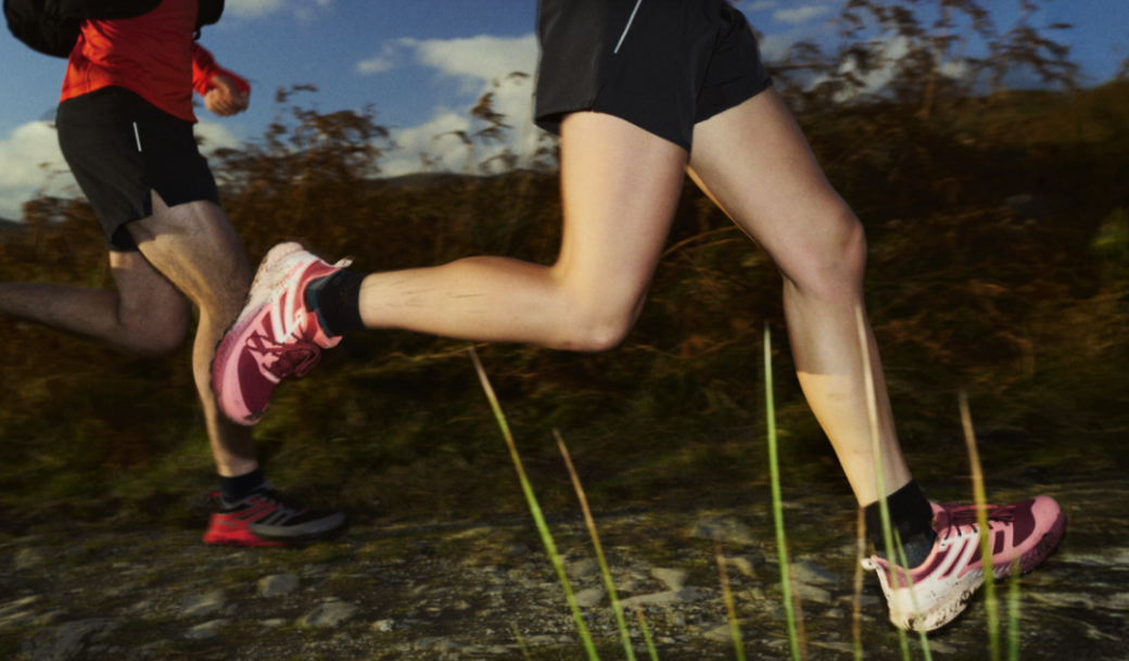 runners splashing through a trail path