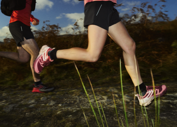 runners splashing through a trail path